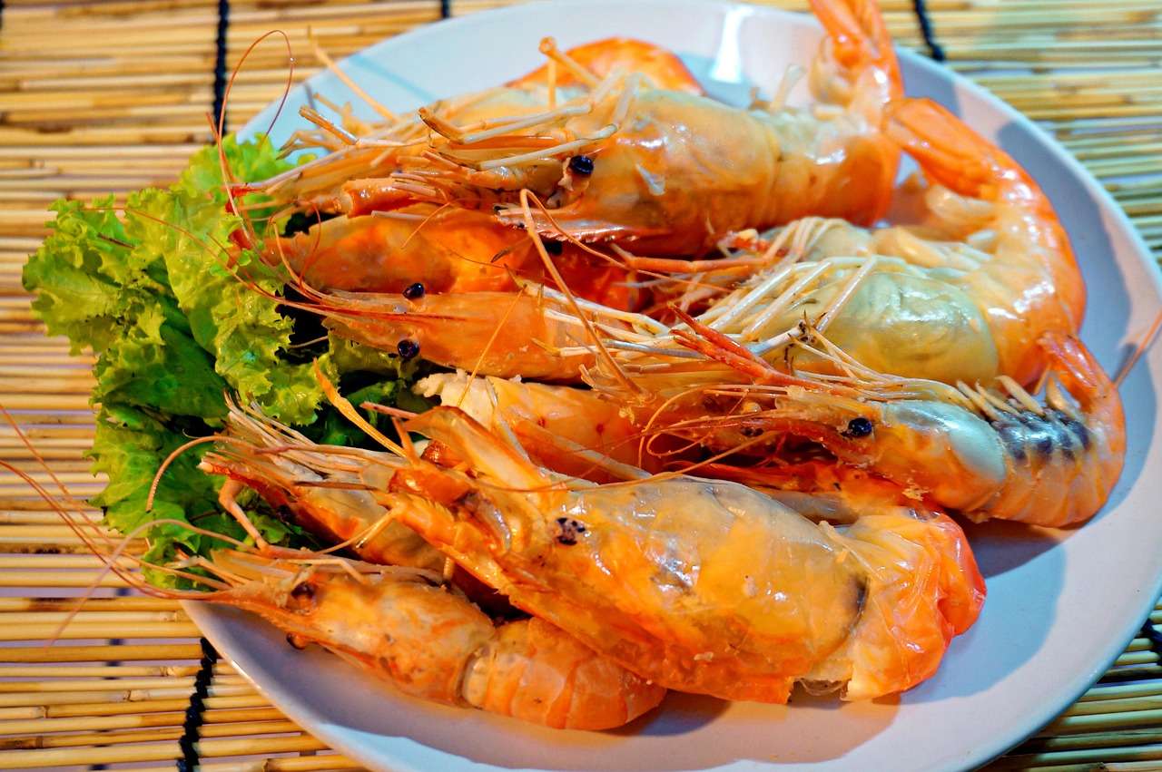 Llagostins al forn amb salsa de taronja i mel